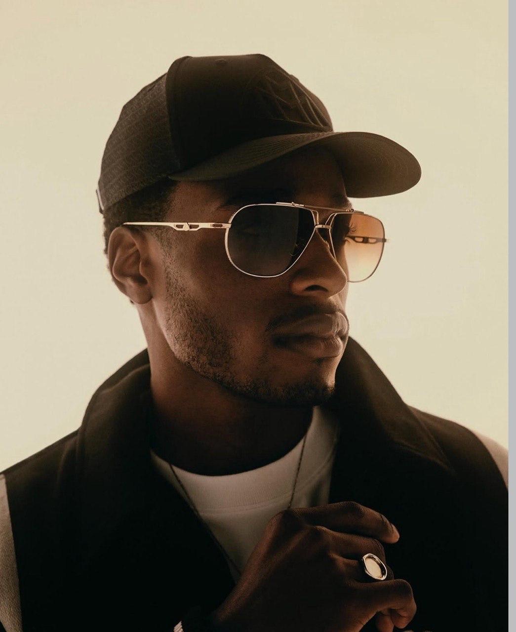Man wearing gold aviator sunglasses
