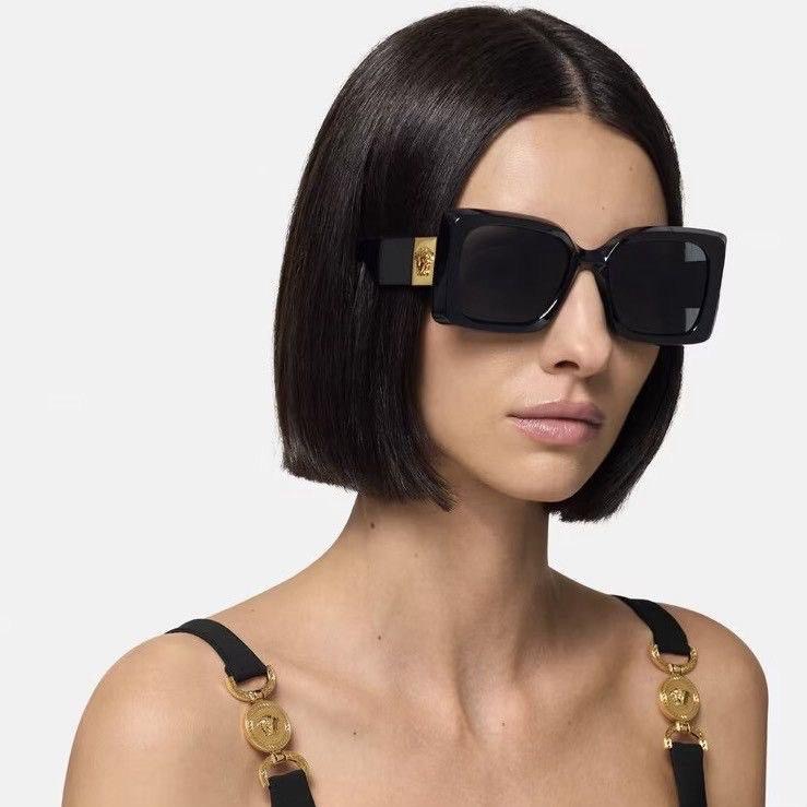 Woman wearing oversized designer sunglasses